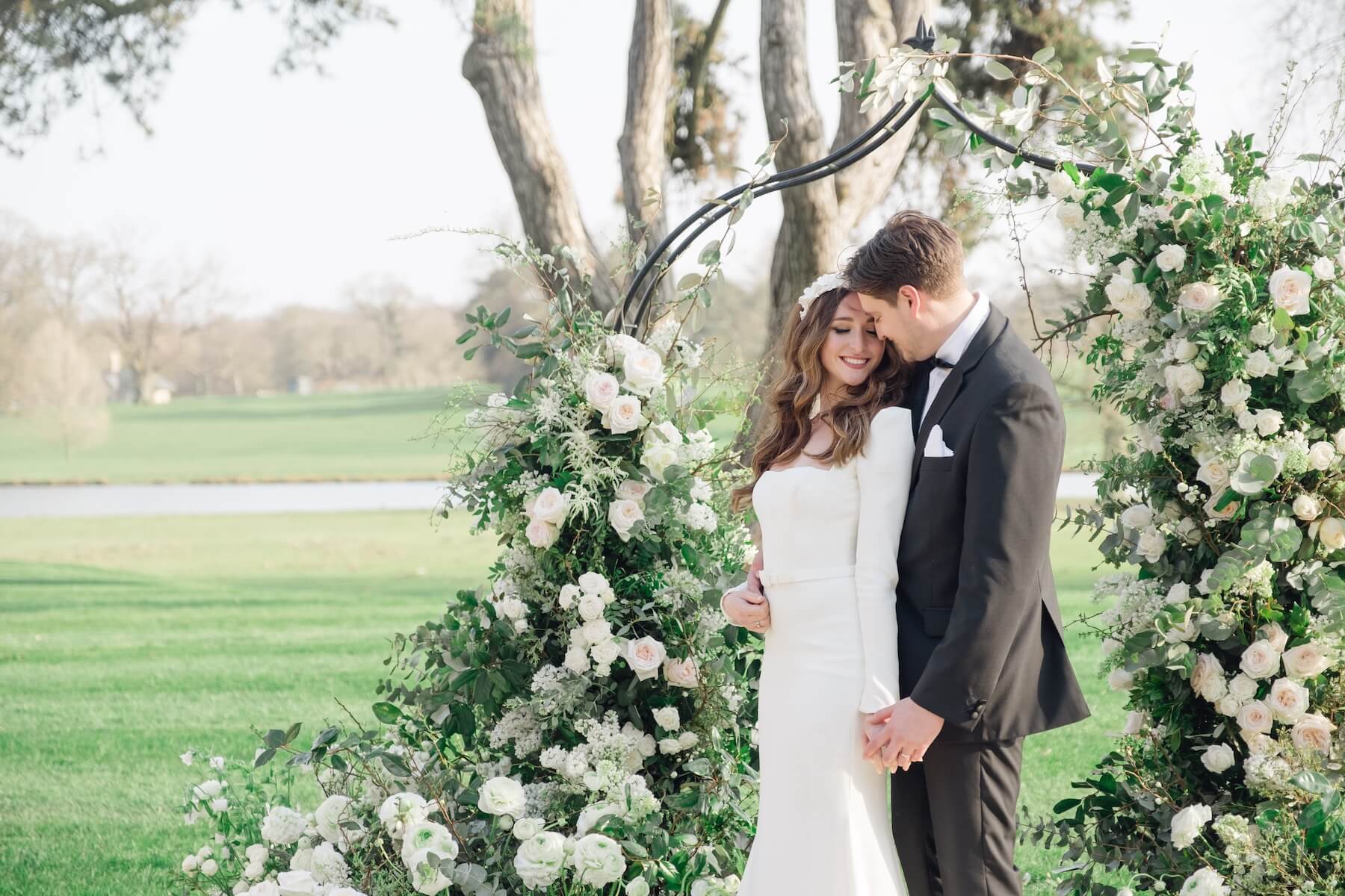 A couple meeting their wedding photographer, questions to ask before booking
