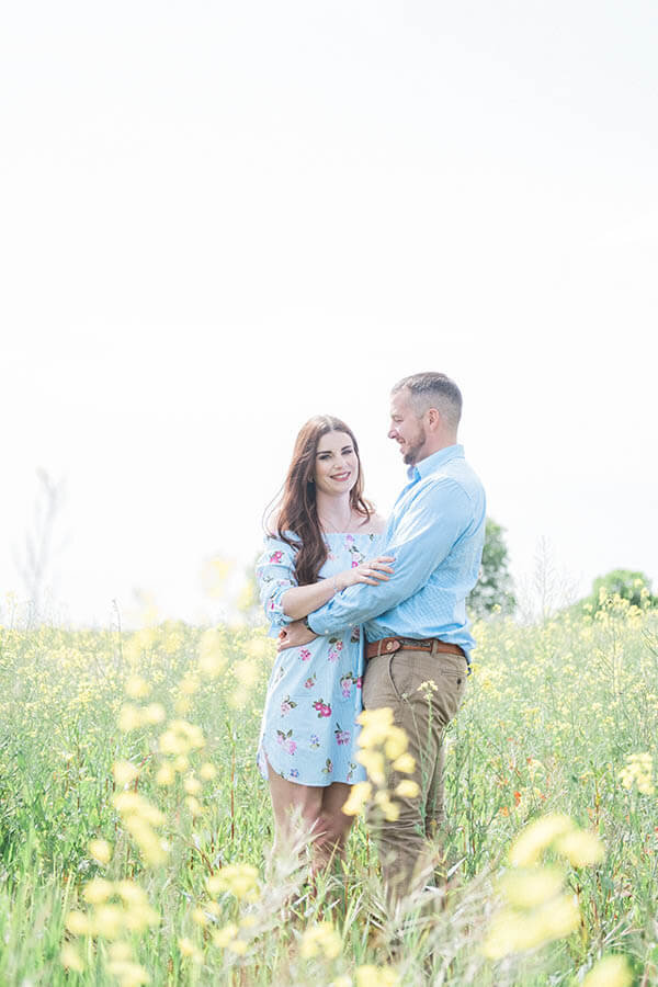 Engagement shoot, couple getting comfortable in front of the camera