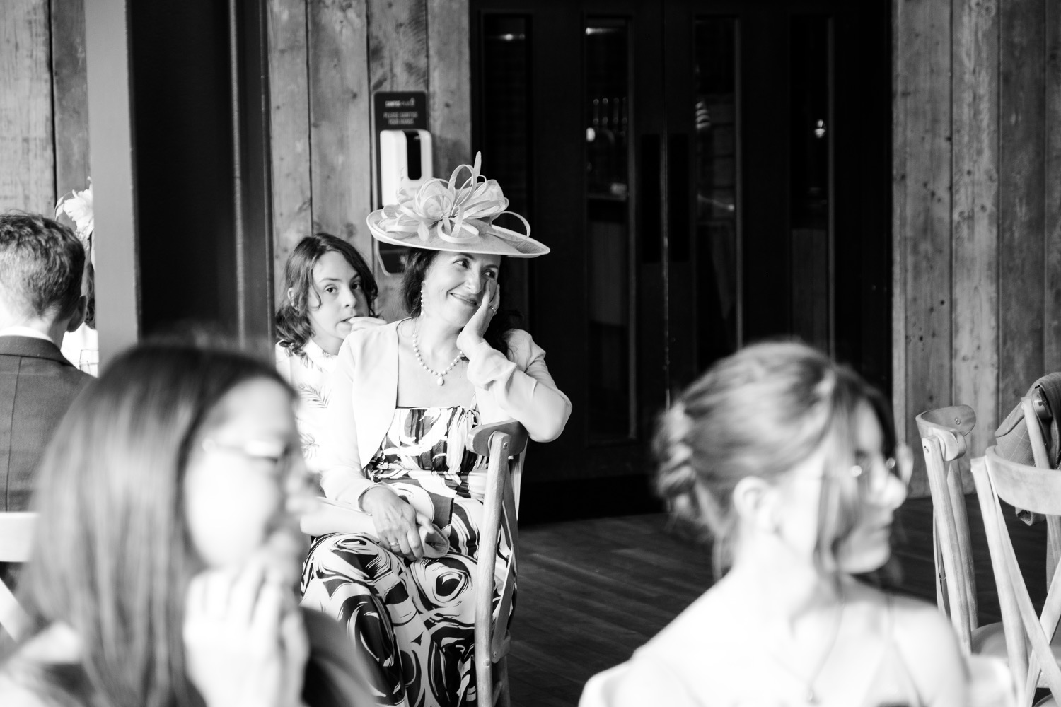 Guest in a wedding hat at Foxtail Barns