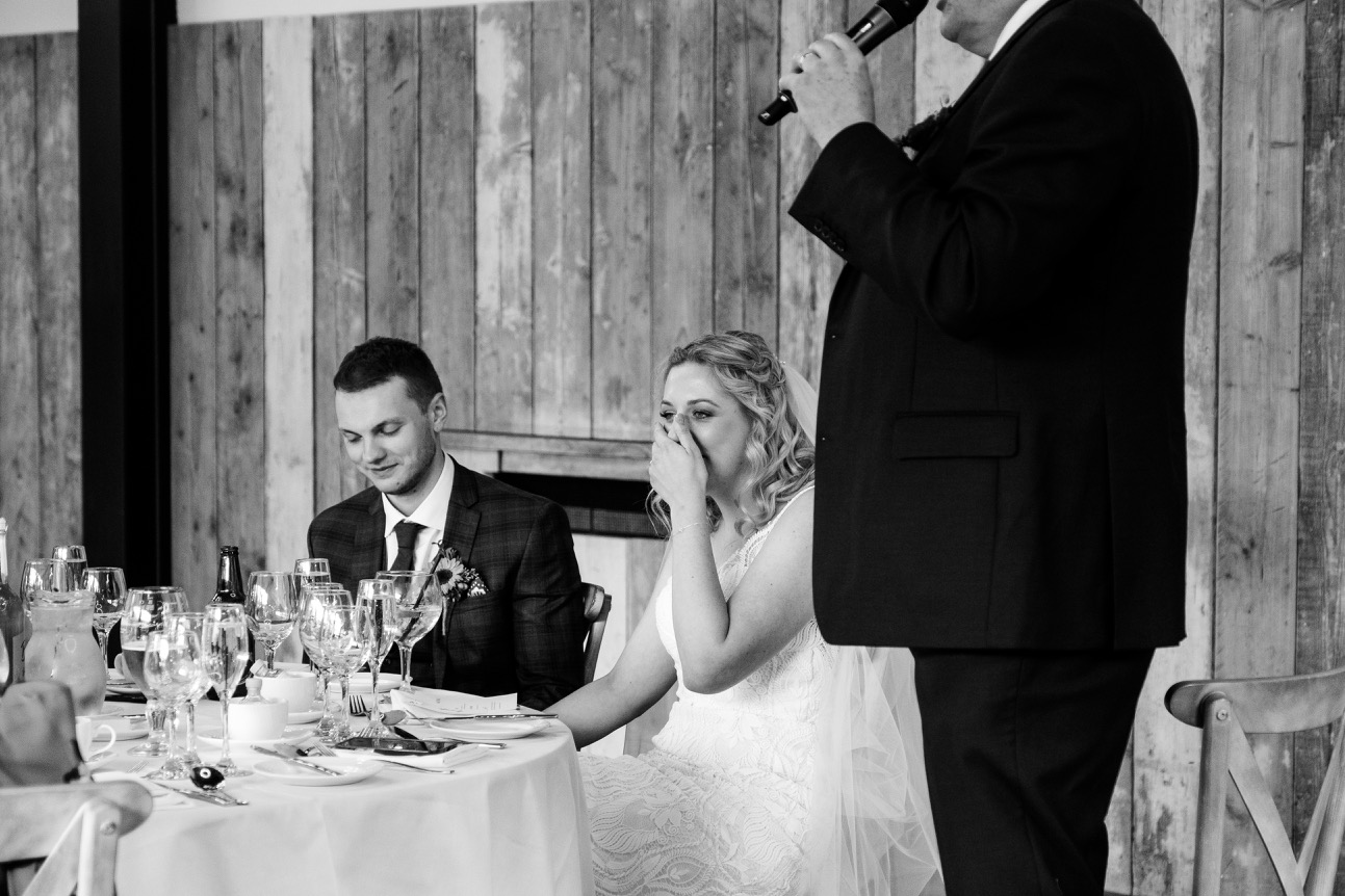 Bride reacting to her father's speech at Foxtail Barns