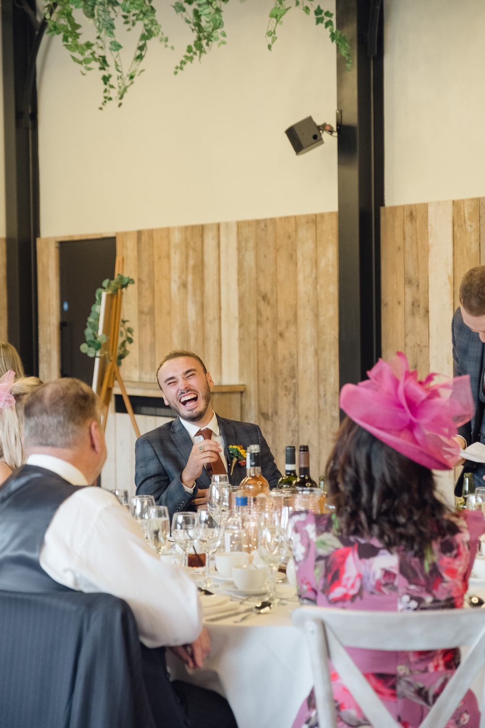 Best man laughing during the speeches at Foxtail Barns