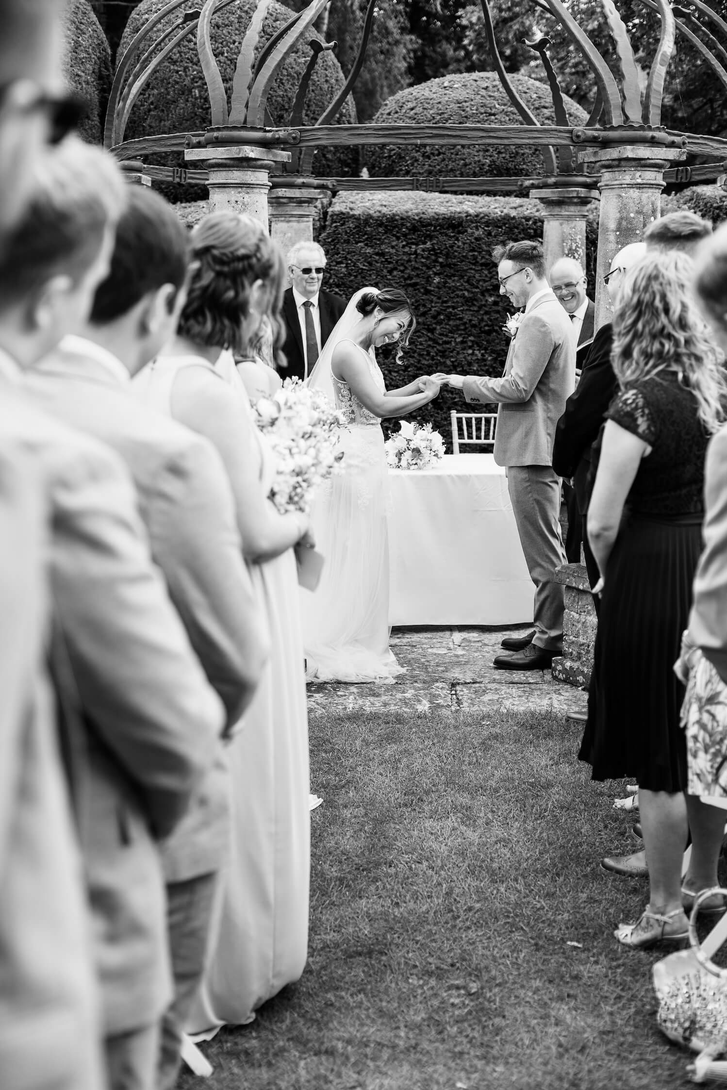 Bride and groom during their White Garden ceremony at Birtsmorton Court in the Malvern Hills