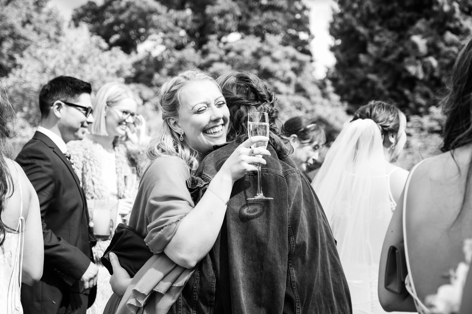 Guests embracing at the Birtsmorton Court wedding