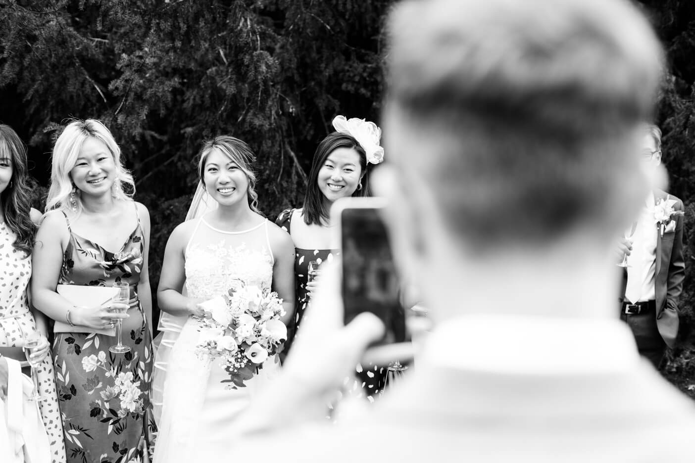 Groom photographing the bride during the Birtsmorton Court drinks reception