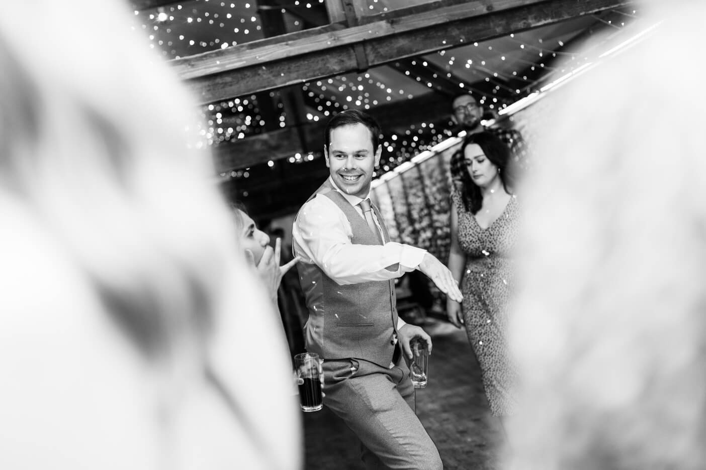 Best man dancing at the Birtsmorton Court evening reception