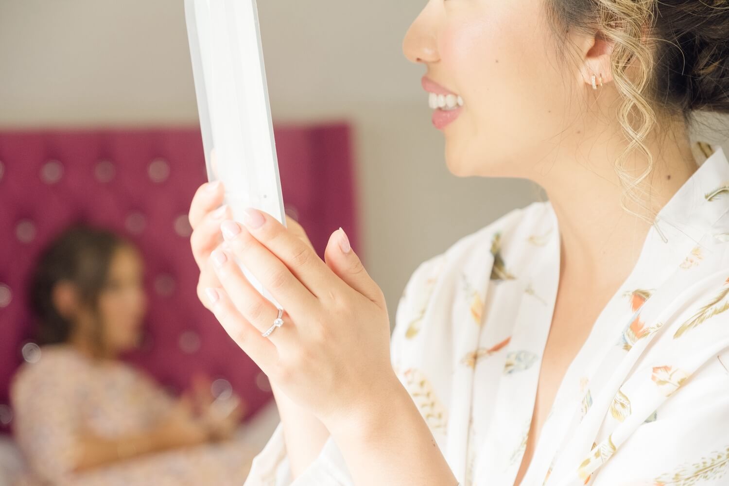 Bride having her makeup done in the bridal suite at Birtsmorton Court