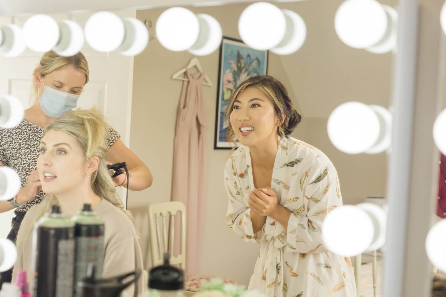 Bride glancing in the mirror on the morning of her Birtsmorton Court wedding