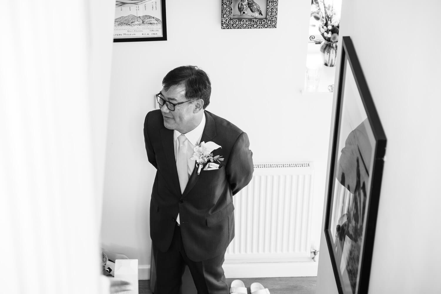 Father of the bride waiting before the ceremony at Birtsmorton Court
