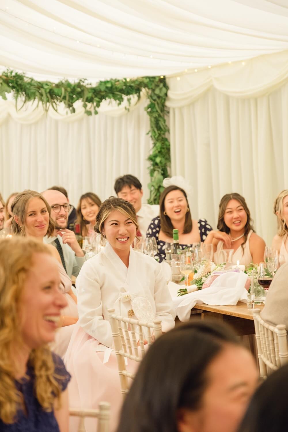 Bride reacting to the speeches at Birtsmorton Court
