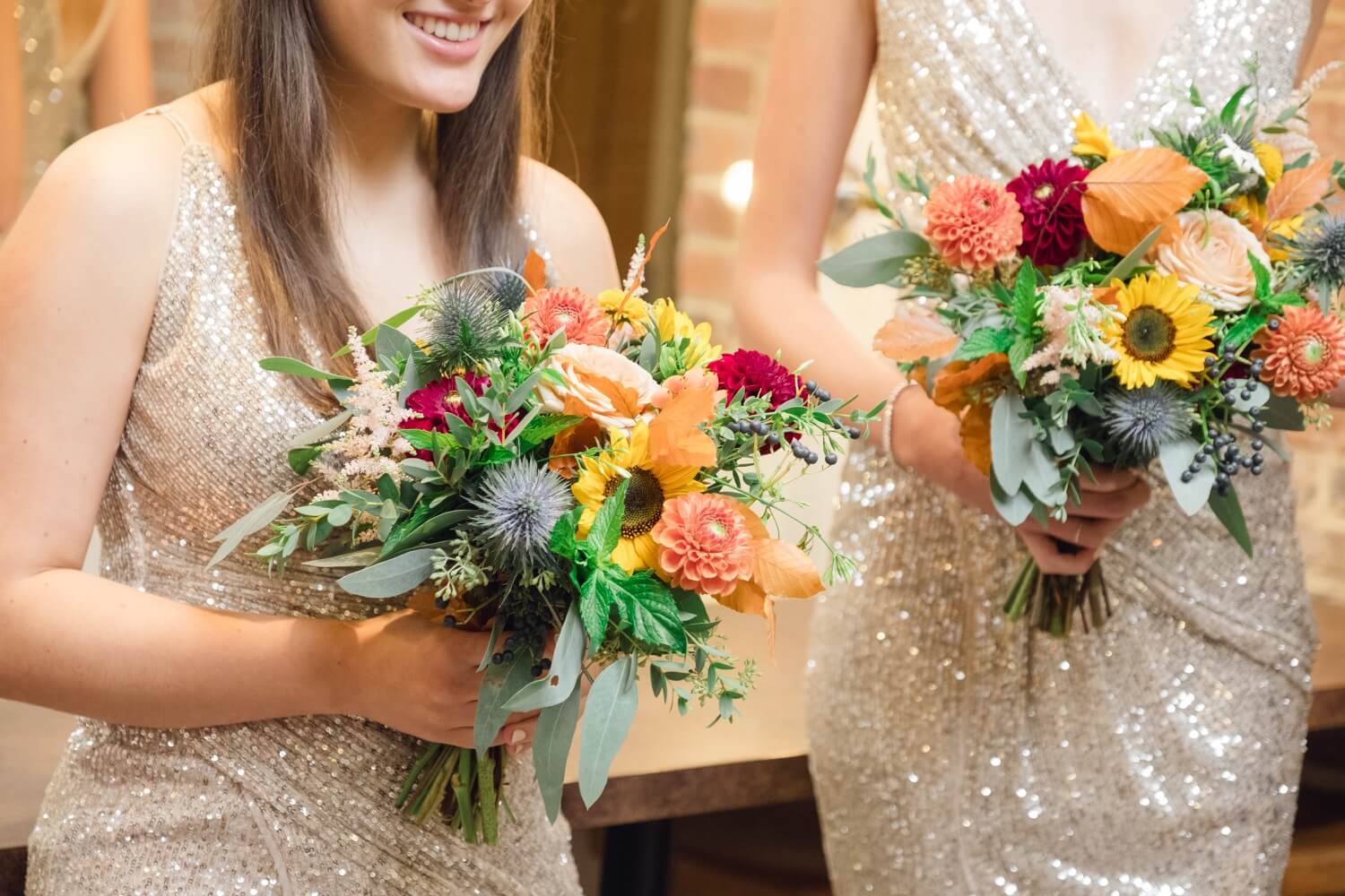 Bridesmaids with flowers in the dressing room at Foxtail Barns