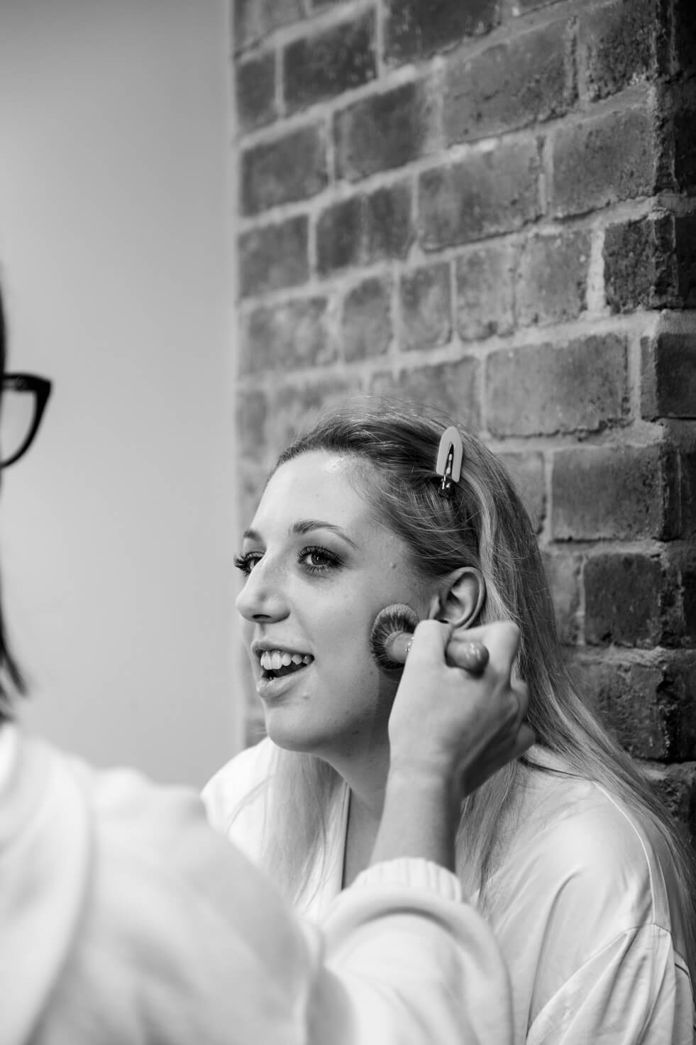 Bride having her makeup done on the morning of her Foxtail Barns wedding
