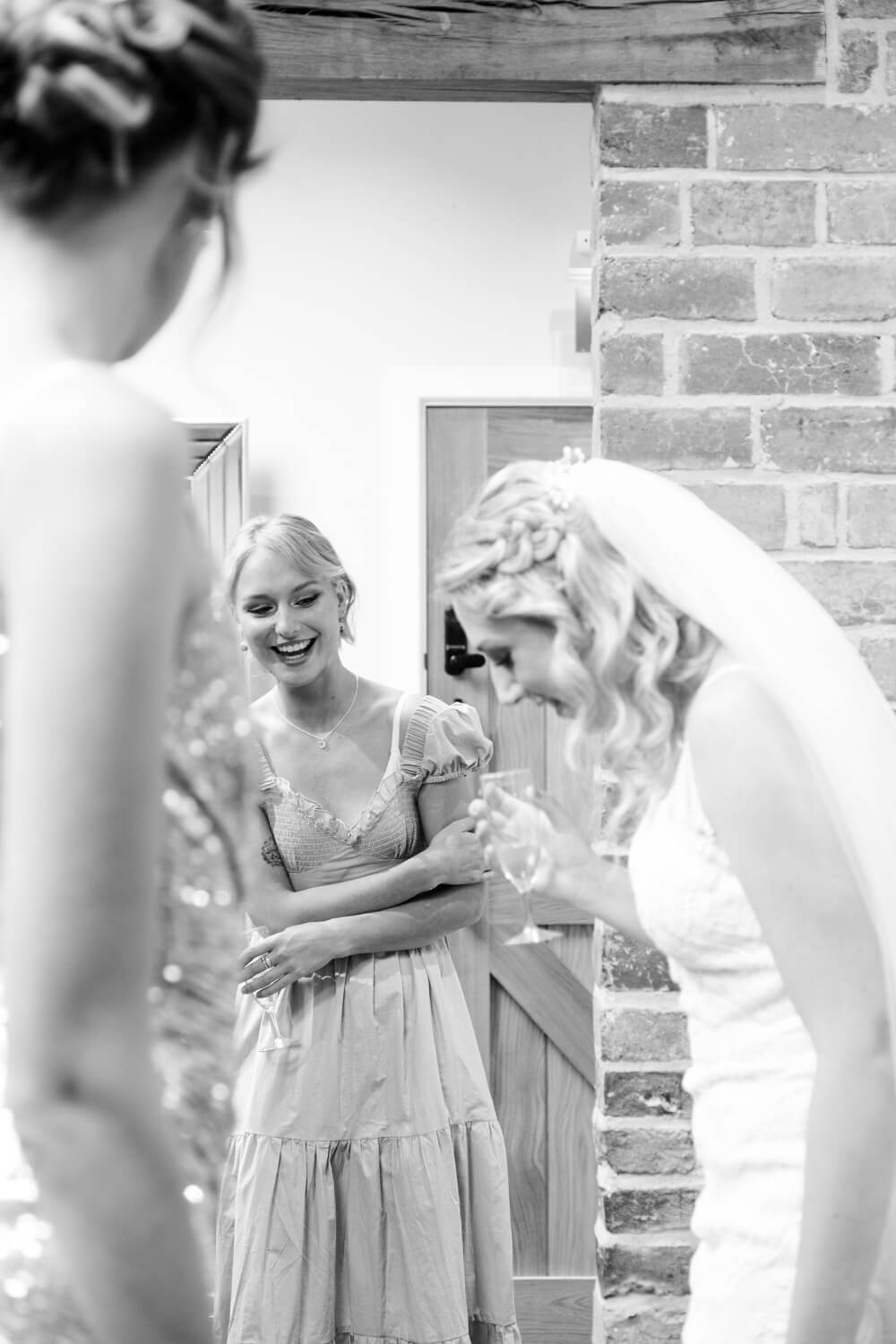 Candid moment between the bride and her bridesmaids