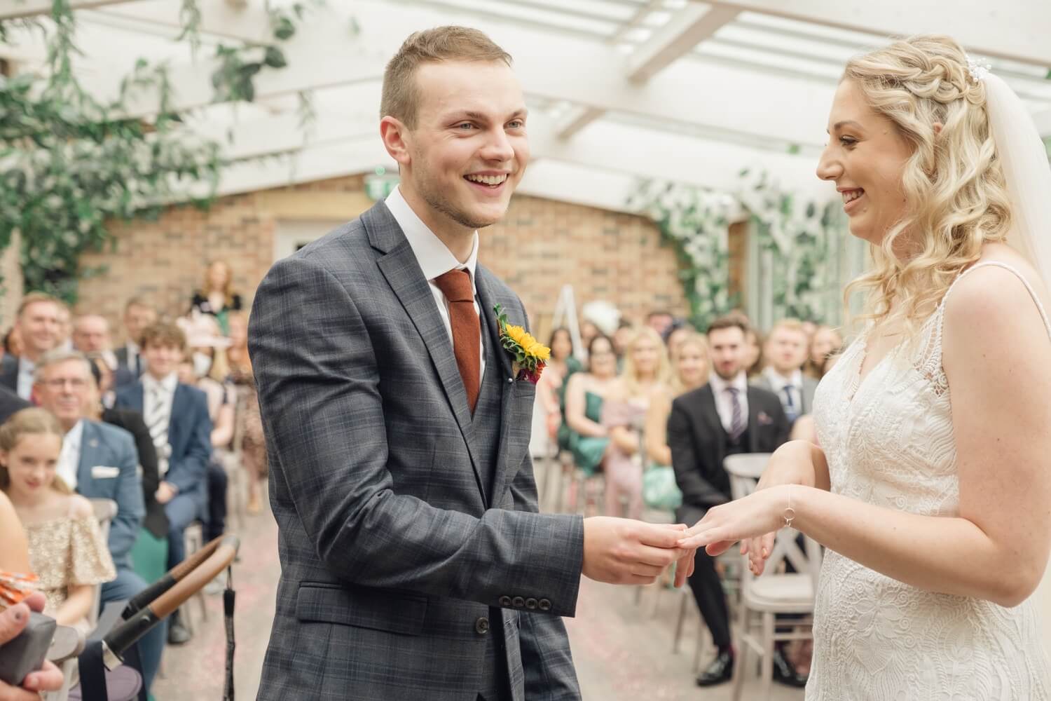 Wedding ceremony underway in the orangery at Foxtail Barns