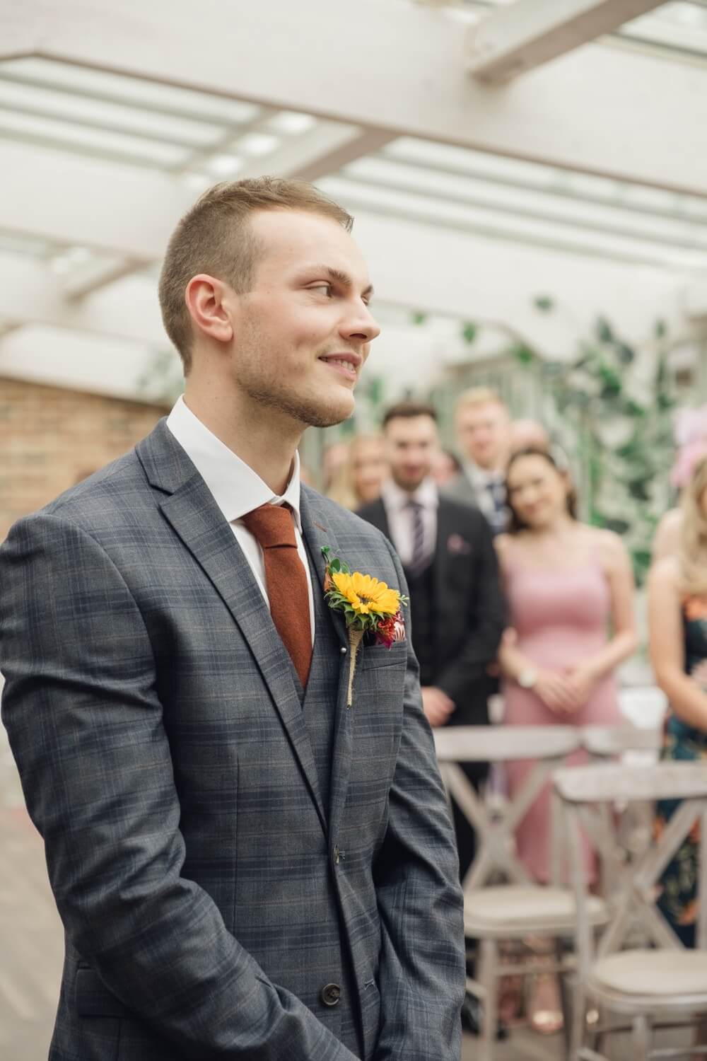 Groom during the wedding ceremony at Foxtail Barns