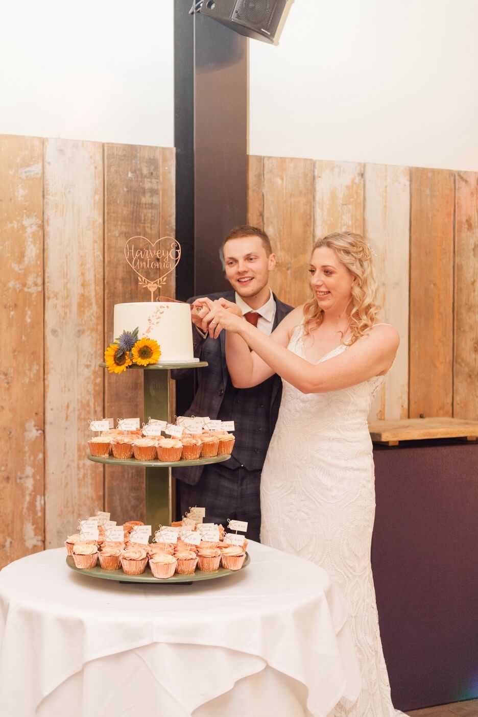 Bride and groom cutting the cake at Foxtail Barns