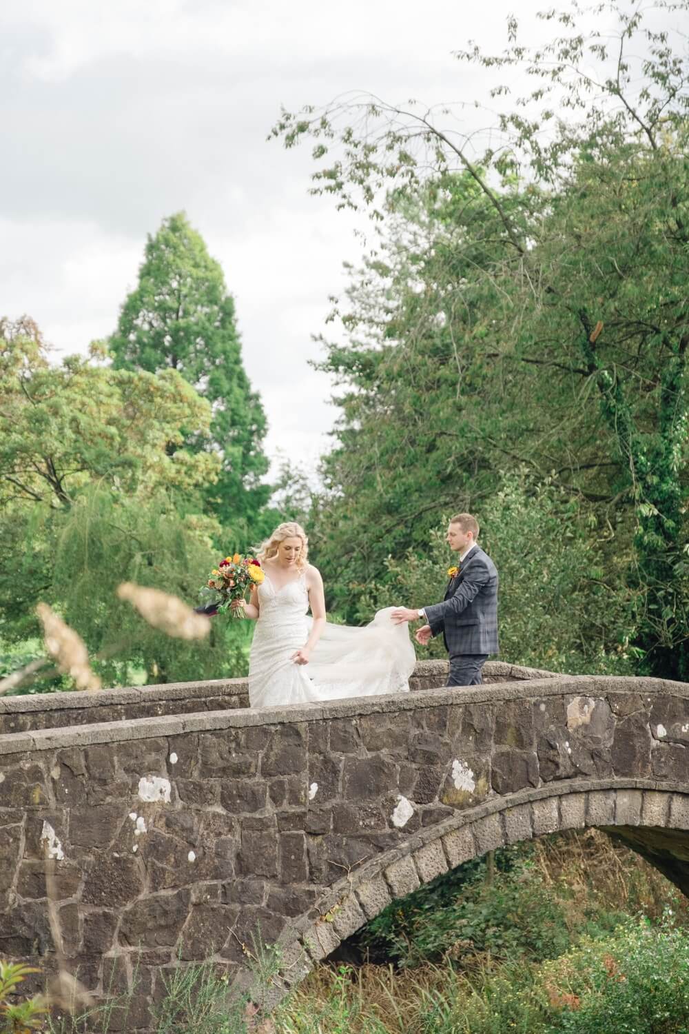 Groom holding the bride close during their Foxtail Barns portraits