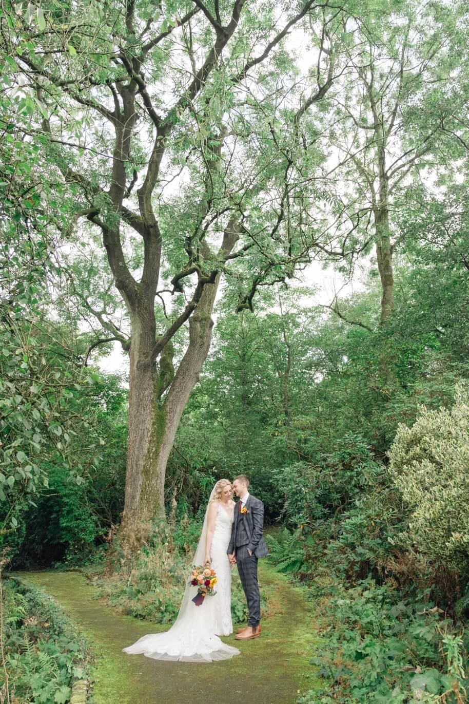Bride and groom in the gardens at Foxtail Barns