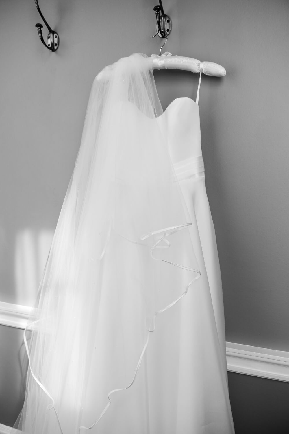 Wedding dress on a hanger at Hawkstone Hall