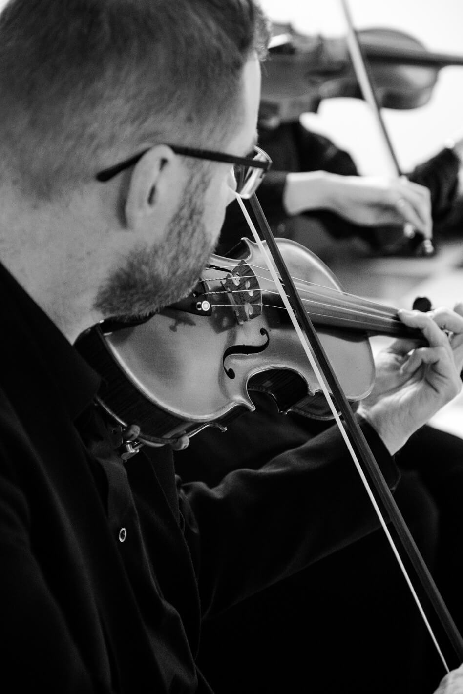 Violinist from the string quartet at Hawkstone Hall Chapel