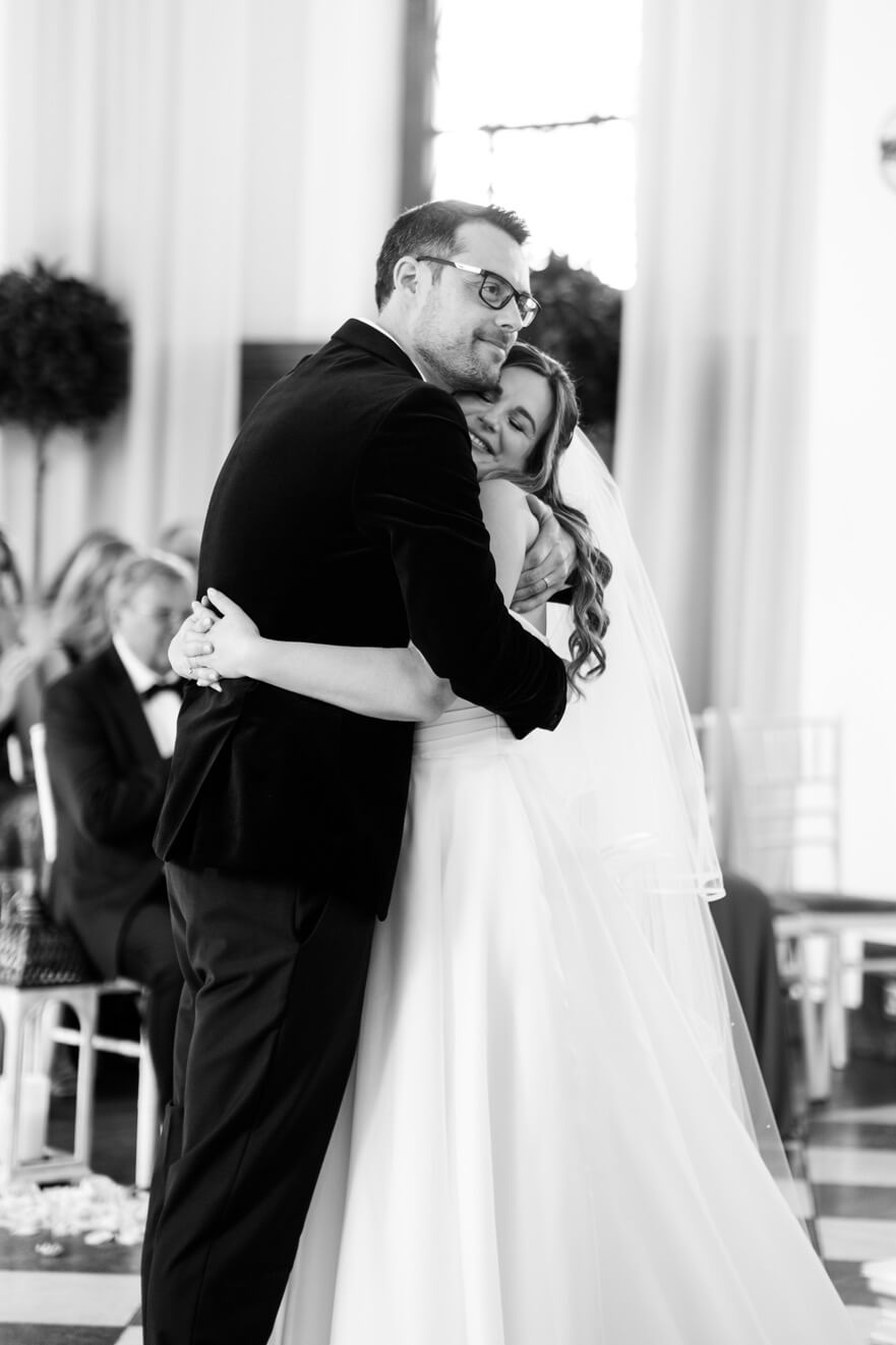 Bride and groom embracing during the ceremony at Hawkstone Hall