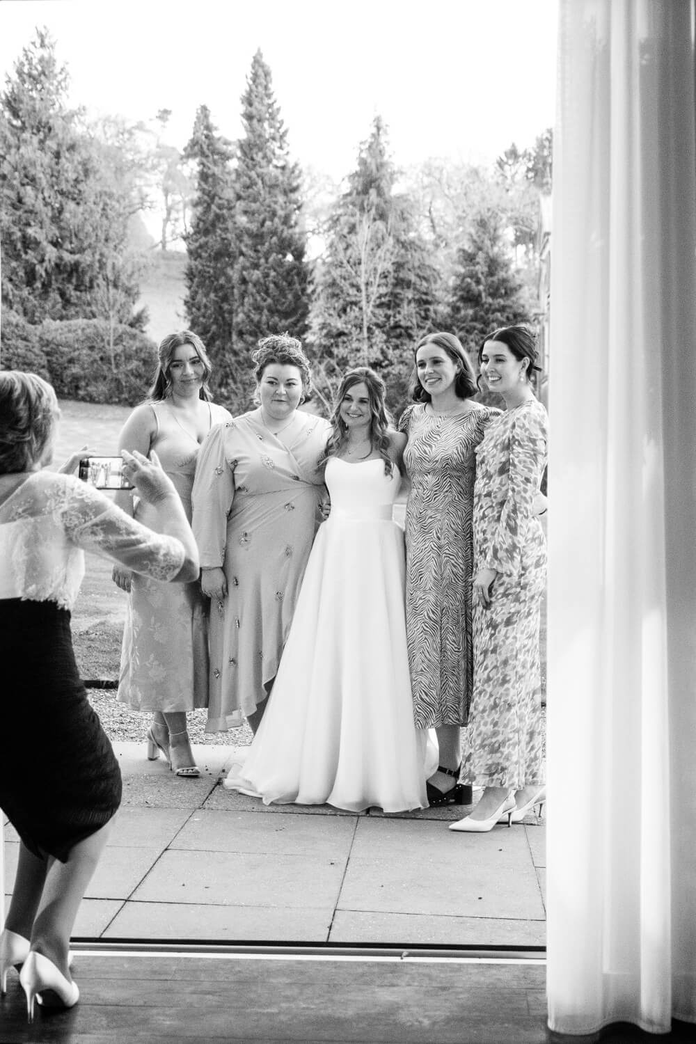 Guests having a photo with the bride at Hawkstone Hall