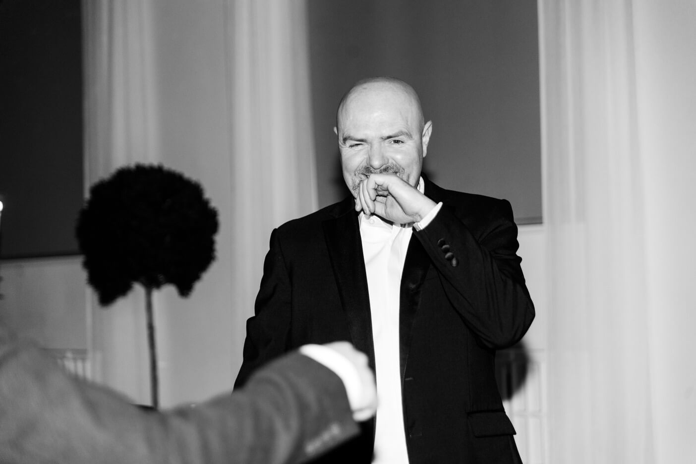 Best man laughing at the Hawkstone Hall evening reception