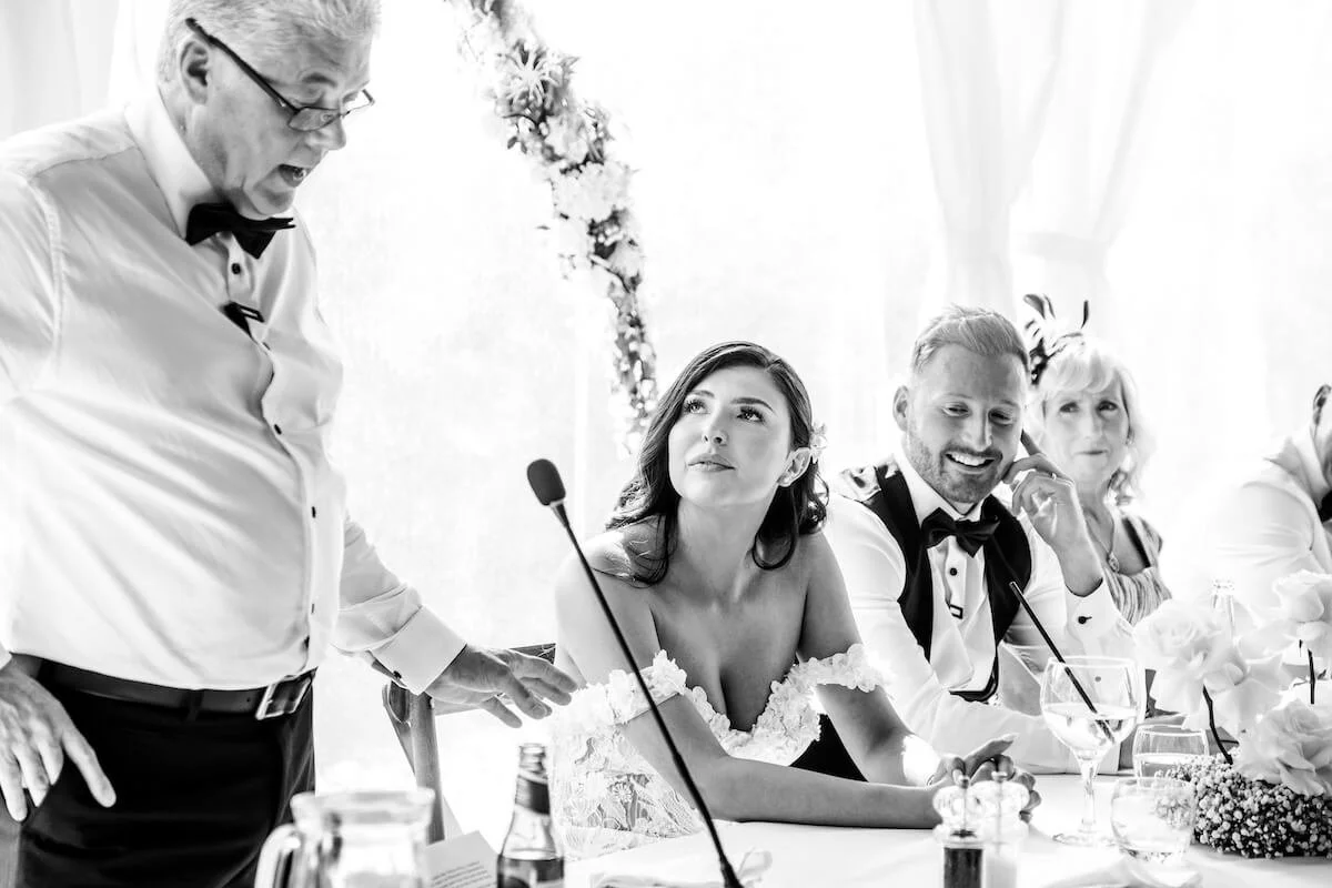 Bride looking at her father during the speeches