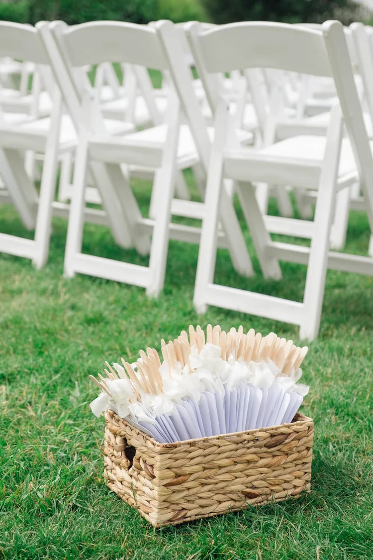 Box of fans for guests at the ceremony