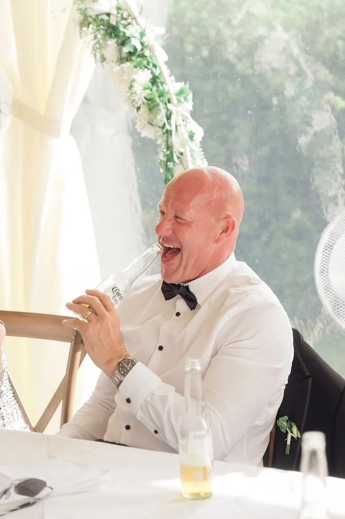 Guest laughing during the speeches