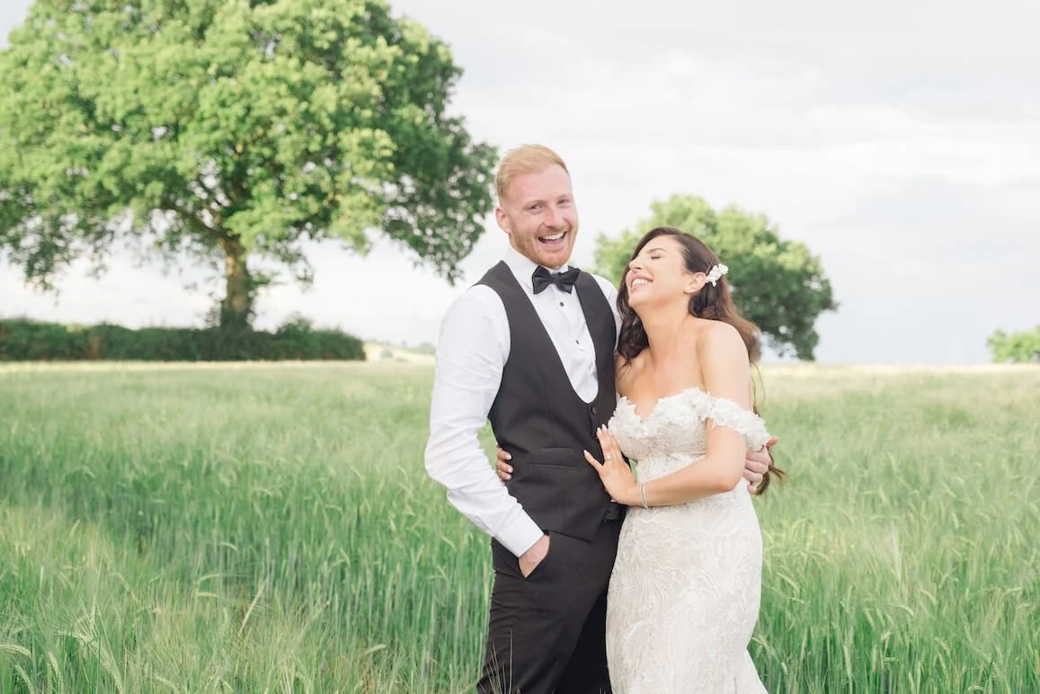 Laughing bride and groom at Manor Hill House