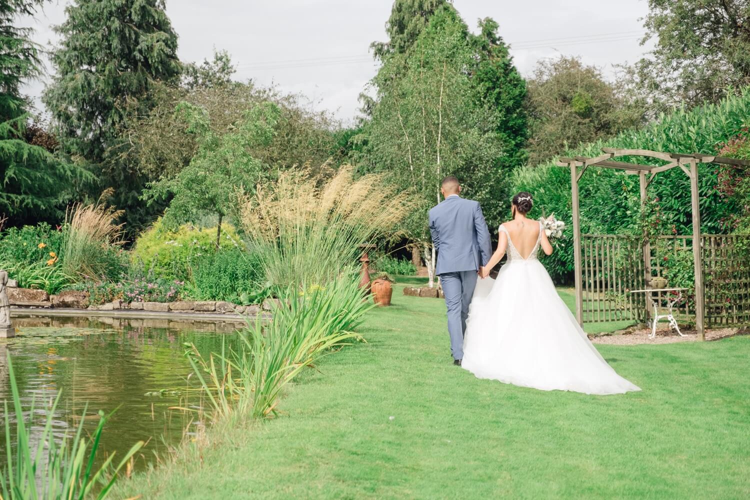 Couple portrait against the Worcestershire countryside at Redhouse Barn