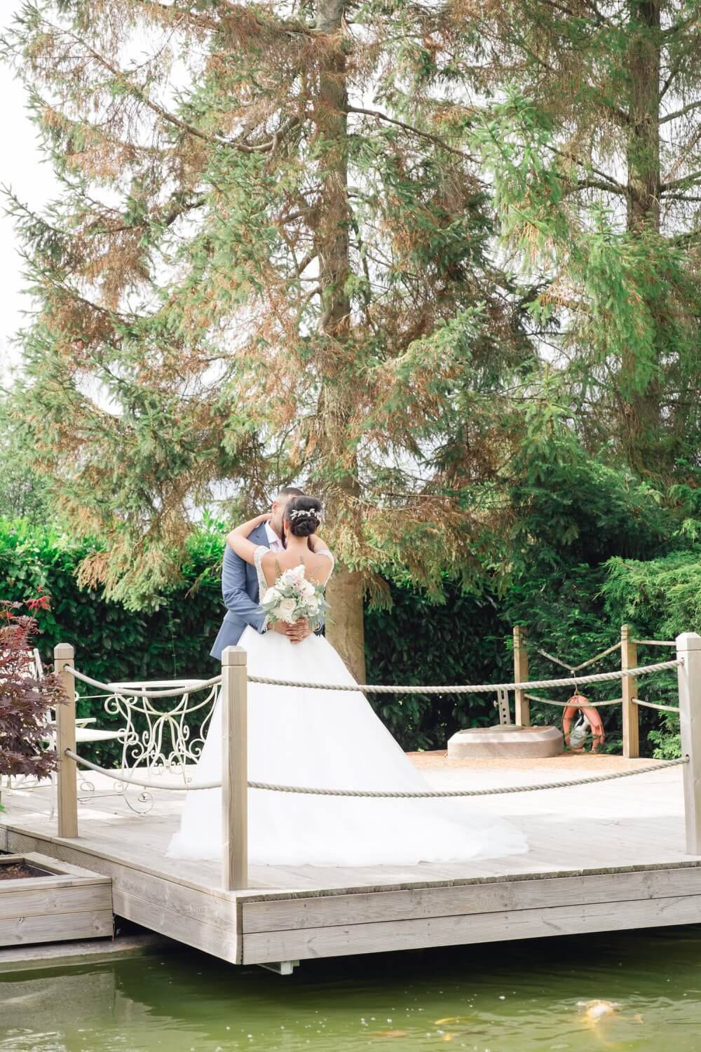Bride and groom portrait in the gardens at Redhouse Barn