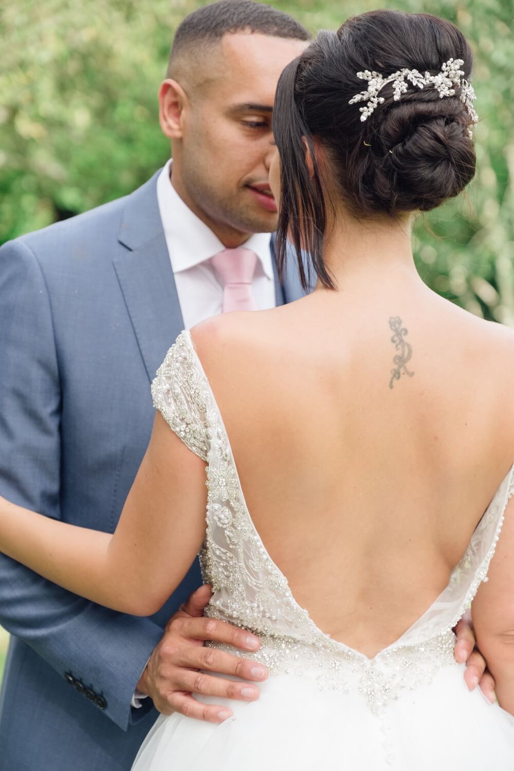 Bride and groom sharing a quiet moment in the gardens