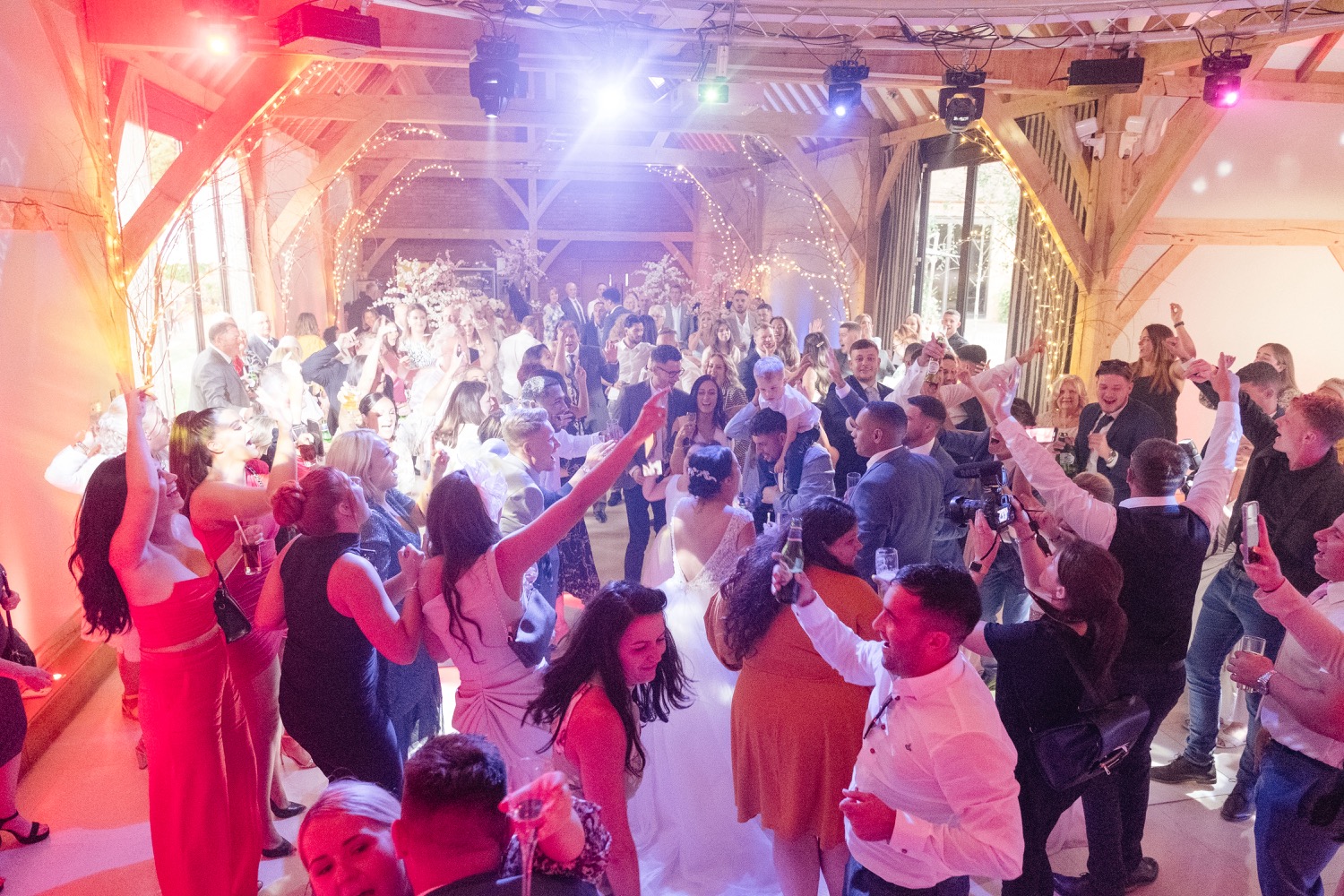 Packed dance floor at the Redhouse Barn evening reception