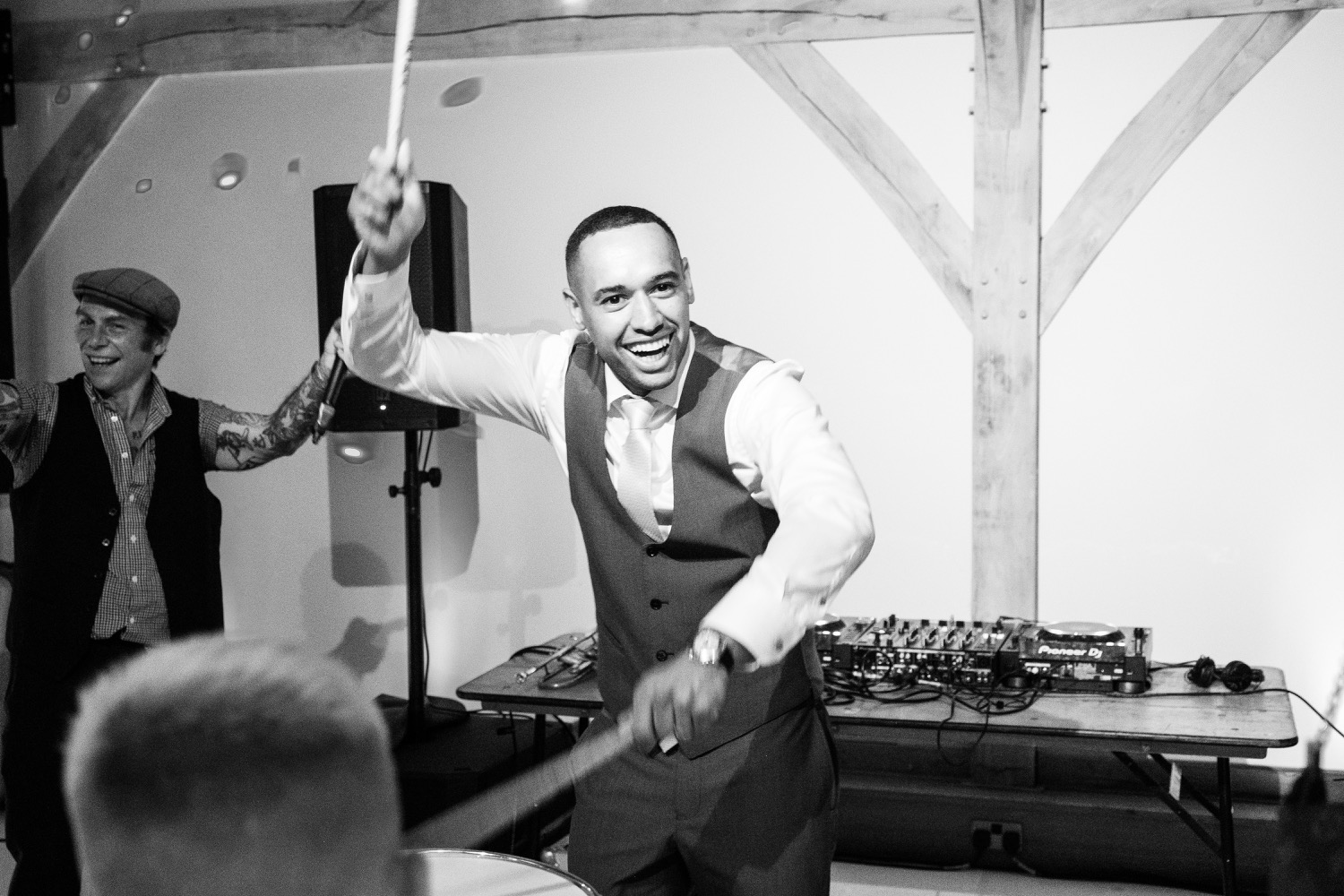 Groom playing the drums at his Redhouse Barn evening reception