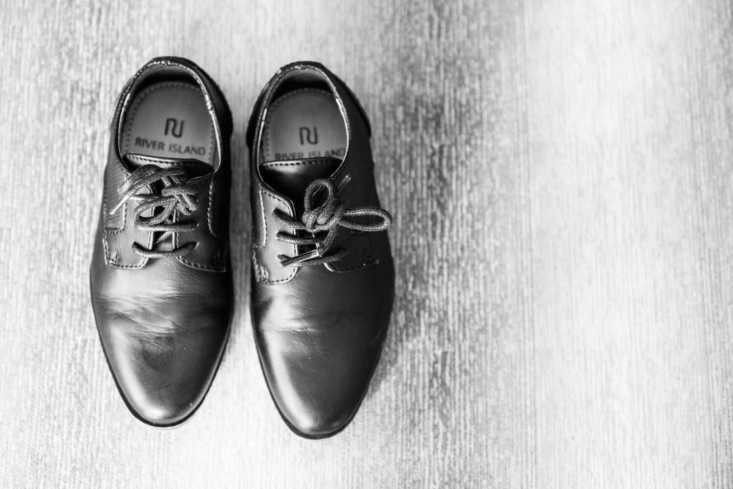 Tiny page boy shoes ready for the wedding at Redhouse Barn