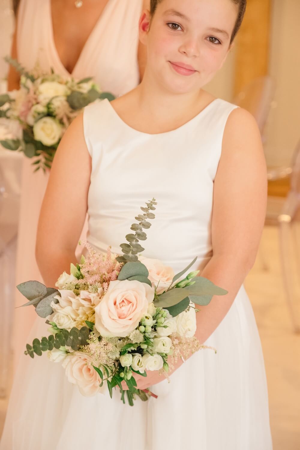 Young flower girl ready for the wedding at Redhouse Barns