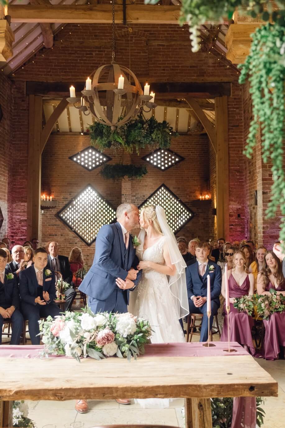 First kiss as a married couple at their Shustoke Barn wedding