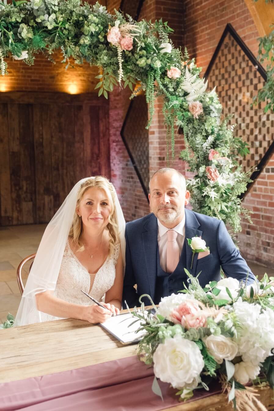 Signing the wedding register at Shustoke Barn