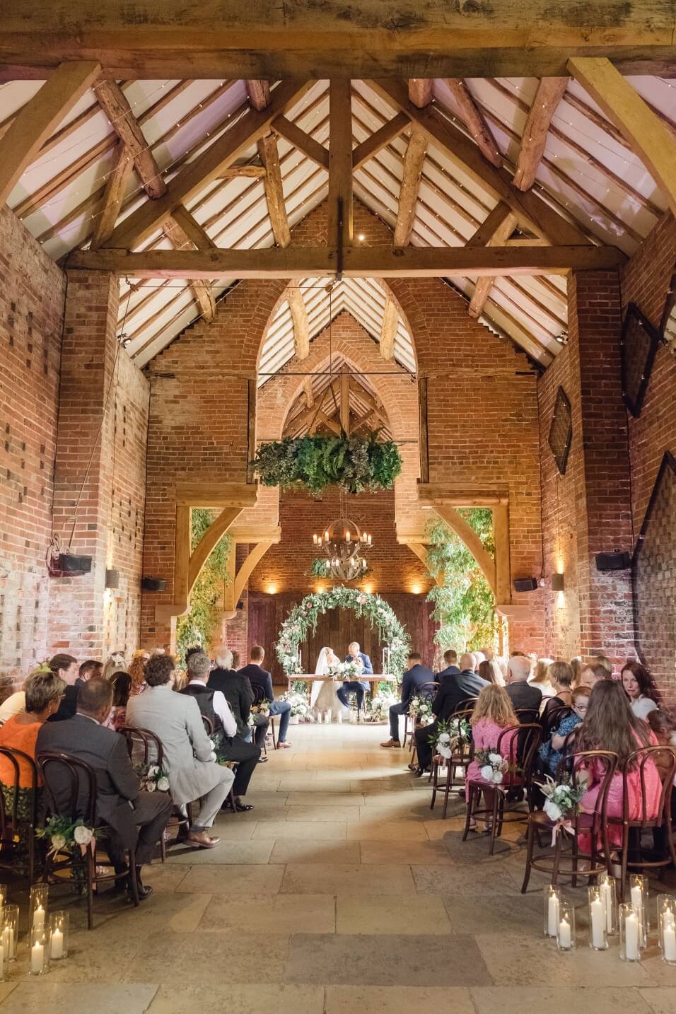 Wedding ceremony at Shustoke Barn photographed from the back of the room