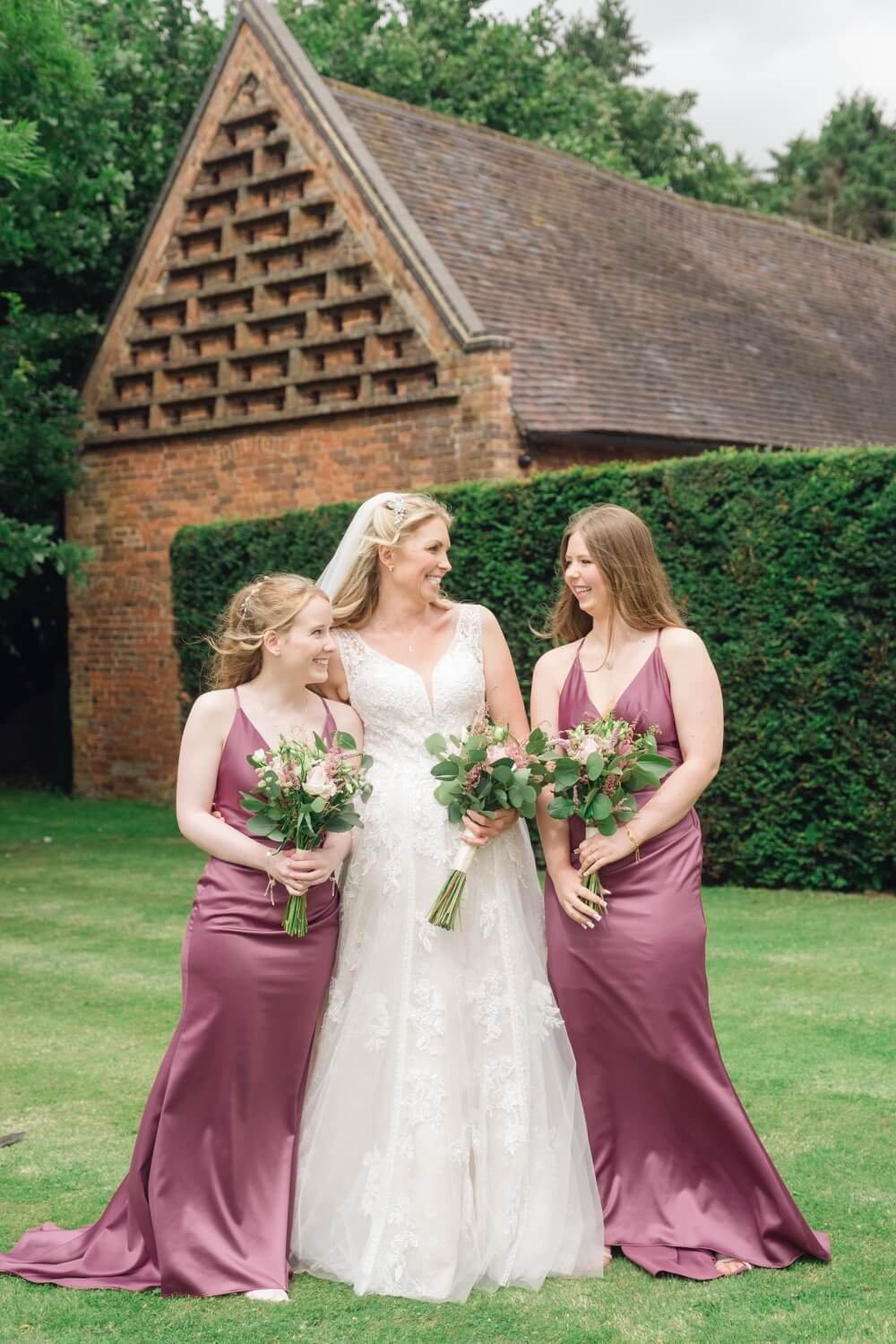 Bride with her bridesmaids at Shustoke Barn