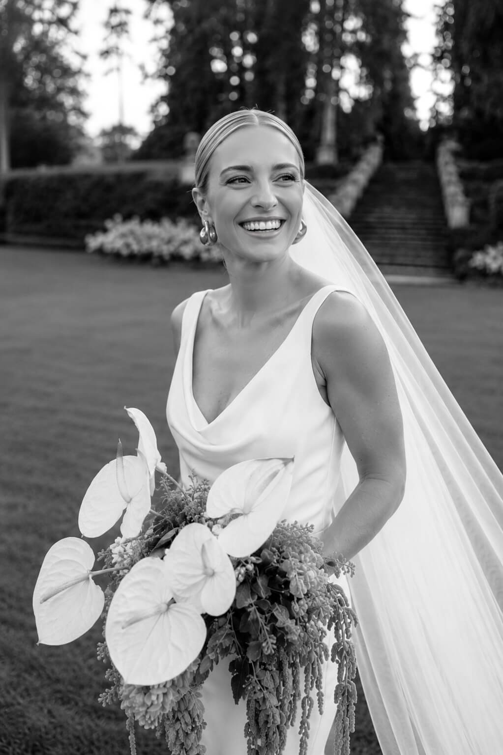 Bride throwing her bouquet at the wedding reception