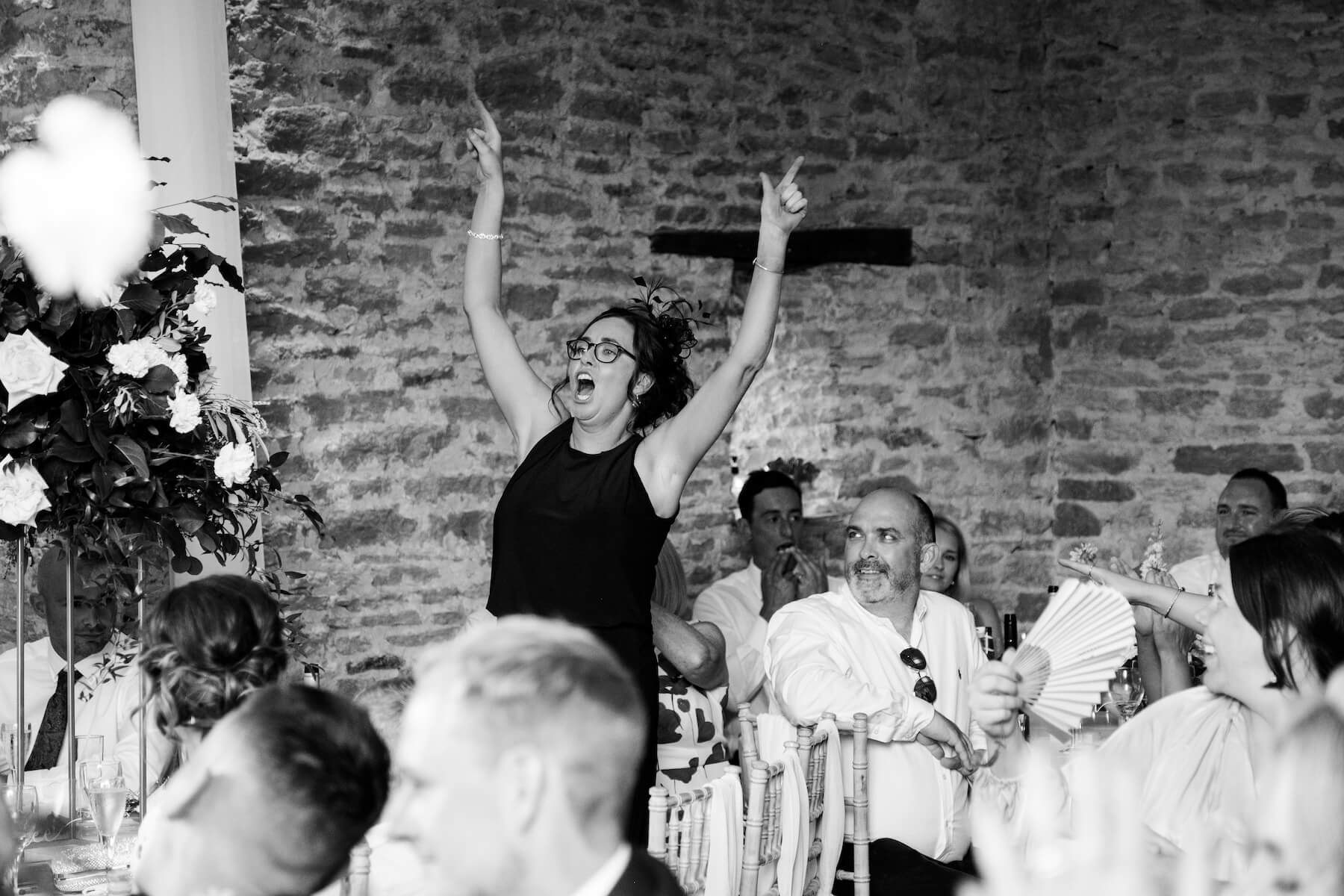 Speeches during the wedding reception at The Great Barn, Aynho