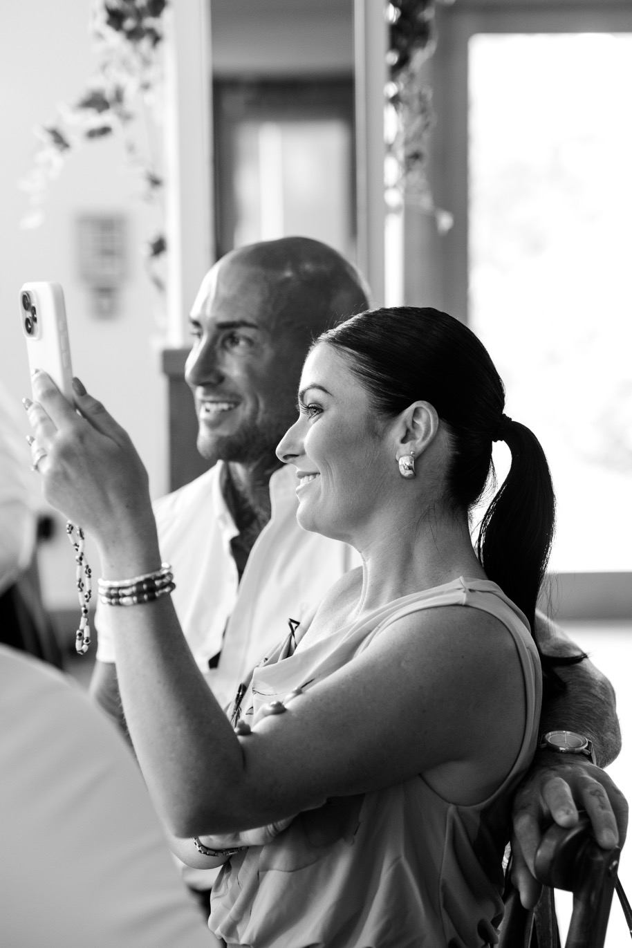 A guest taking a photo during the wedding breakfast