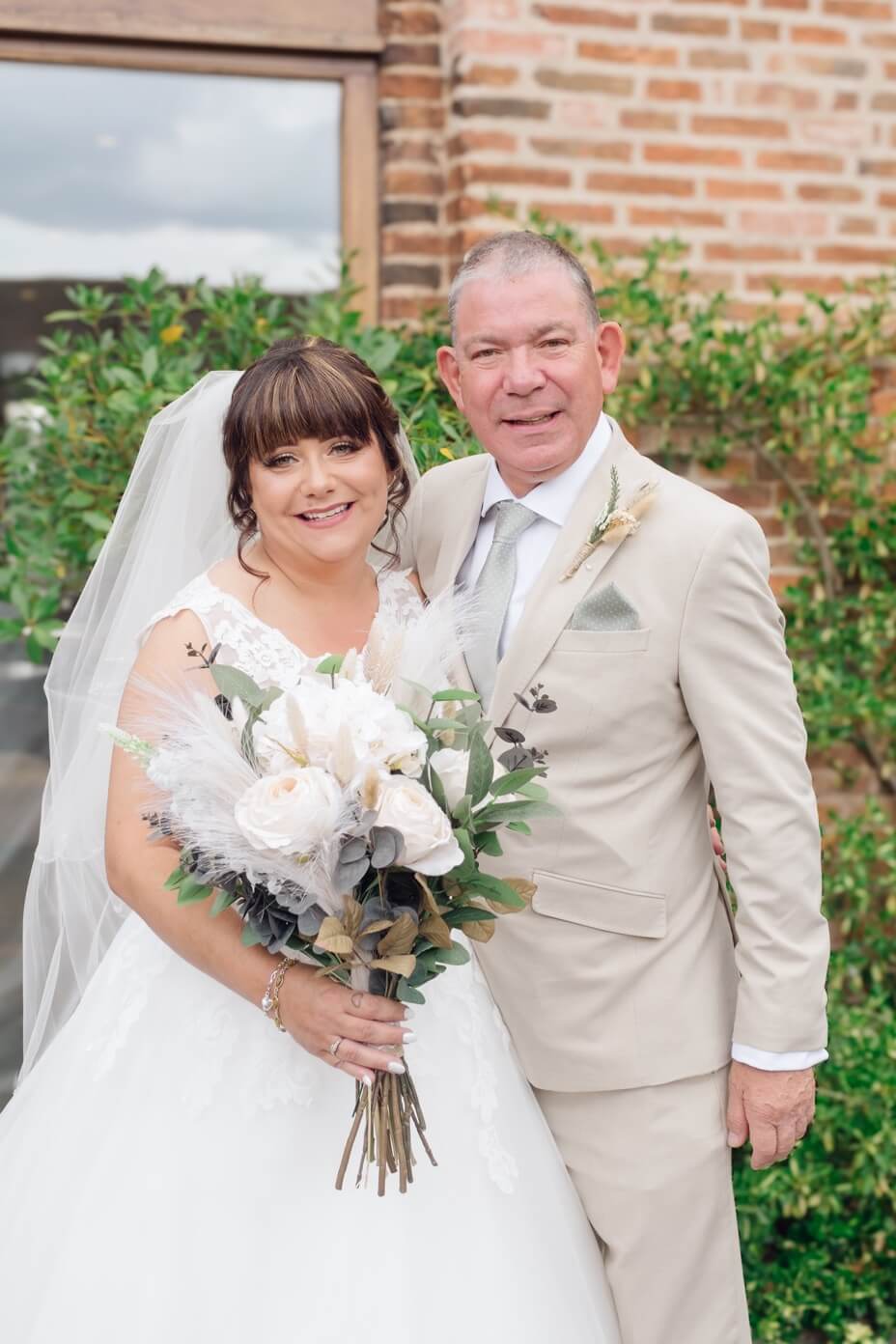 The bride with her dad before the ceremony at Mythe Barn