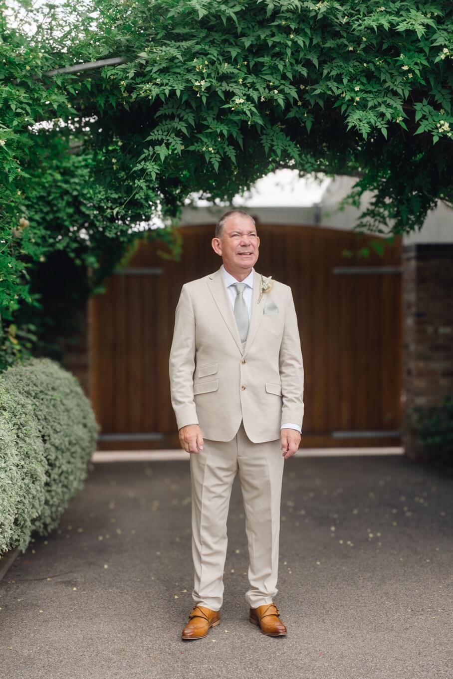 The father of the bride waiting outside before the ceremony