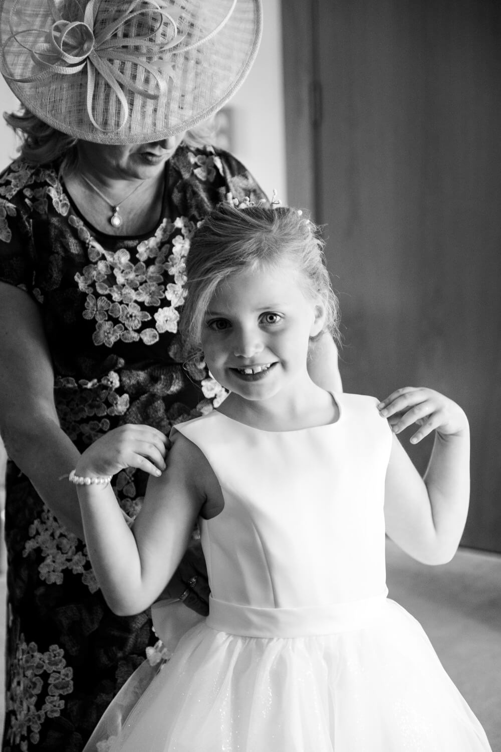 The flower girl smiling at Mythe Barn