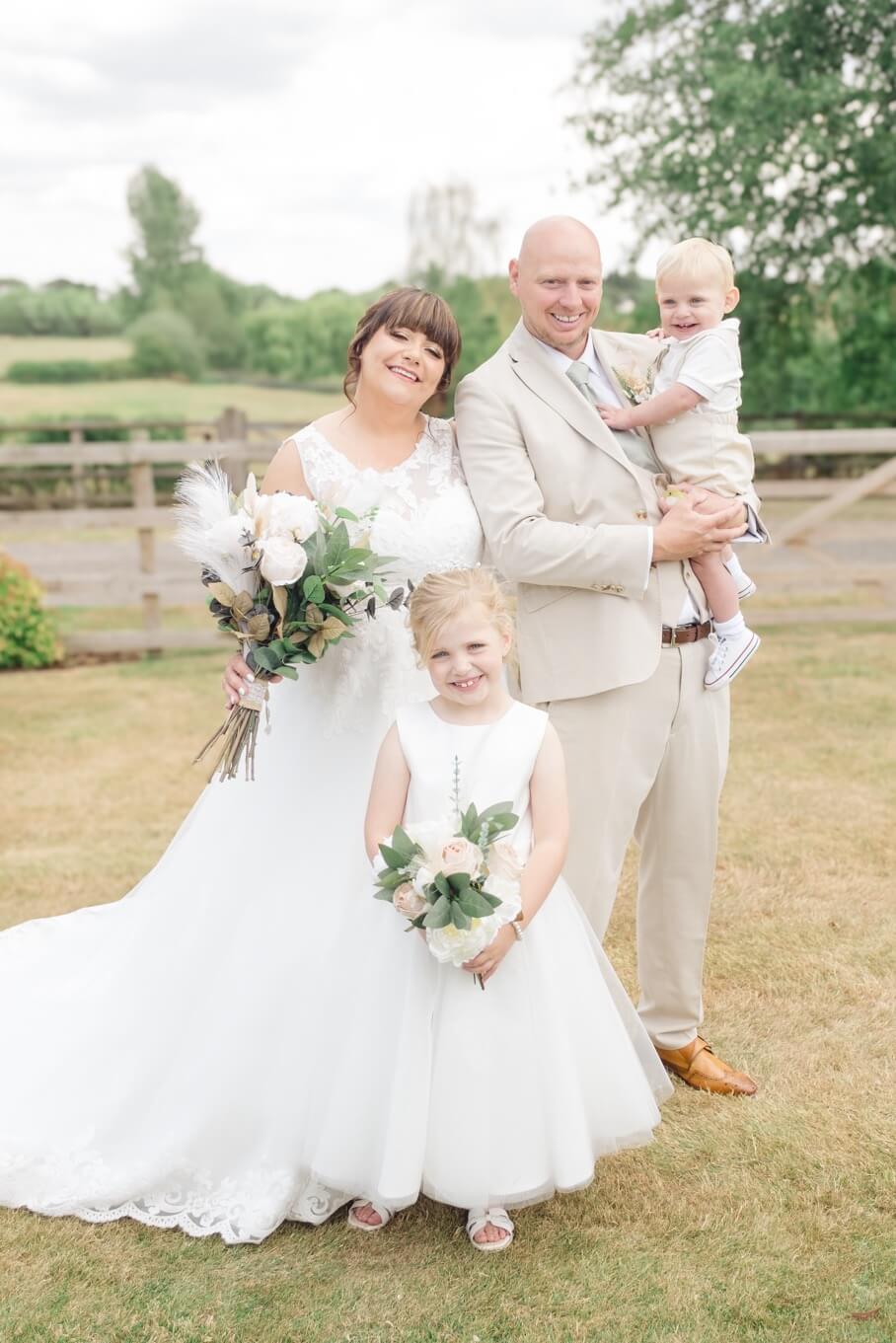 The bride and groom with their son and daughter
