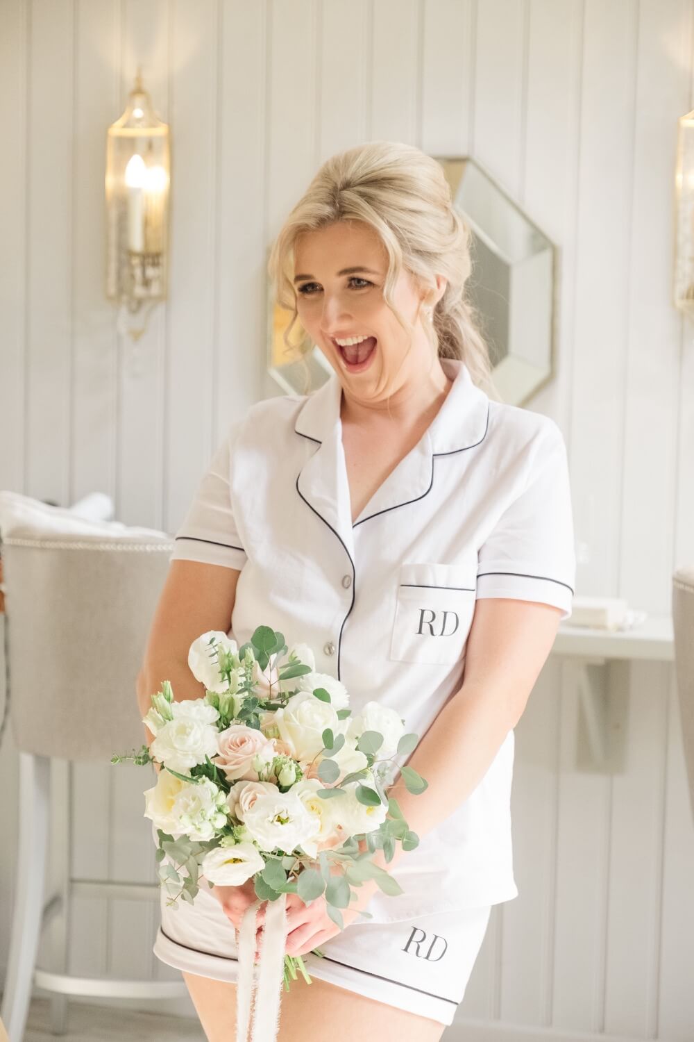 Bride holding her bouquet during morning preparations