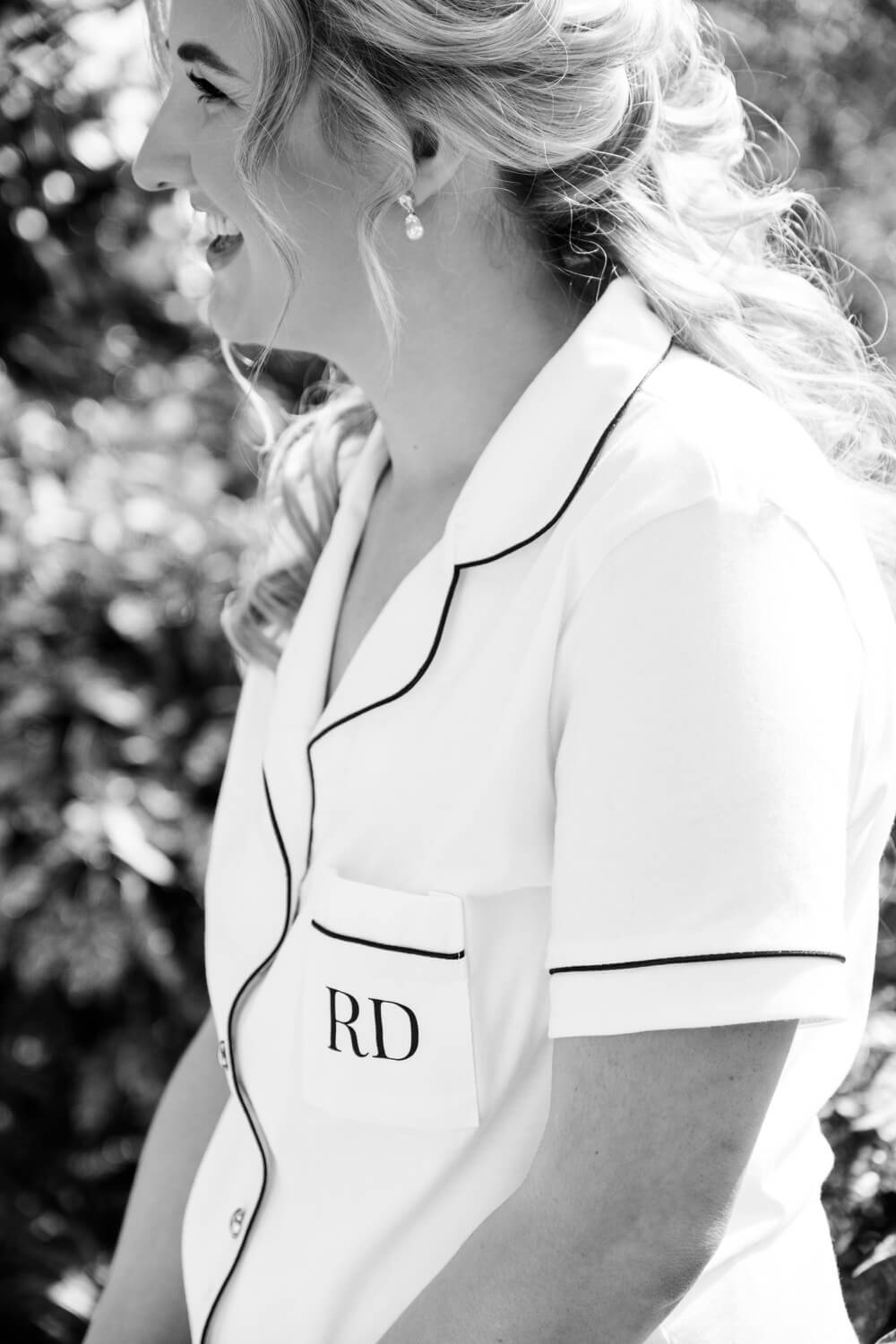 Bride relaxing in pyjamas before her Moxhull Hall wedding